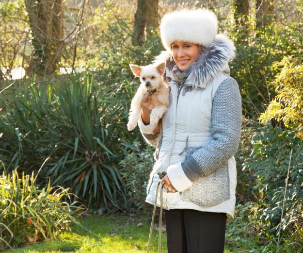 Dame Kiri Te Kanawa coat hat dog