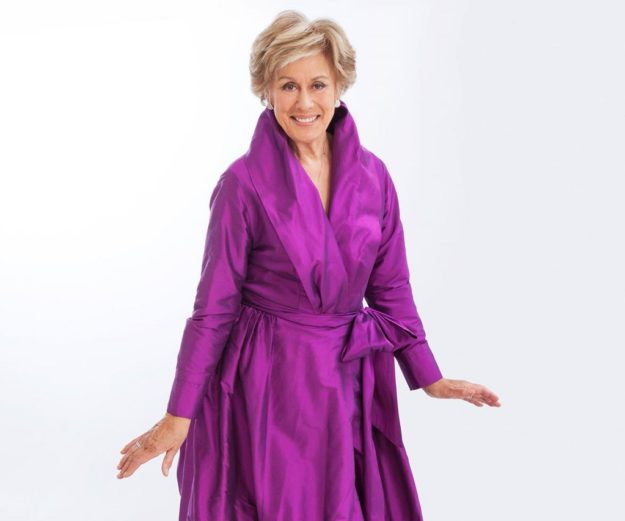 Dame Kiri Te Kanawa purple dress bow